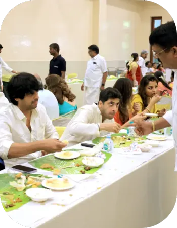 Wedding guests enjoying a traditional meal